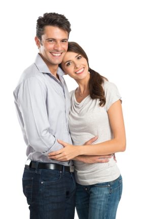 Portrait Of A Happy Young Couple Isolated Over White Background